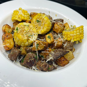 Garlic Parmesan steak, potatoes, and corn bites